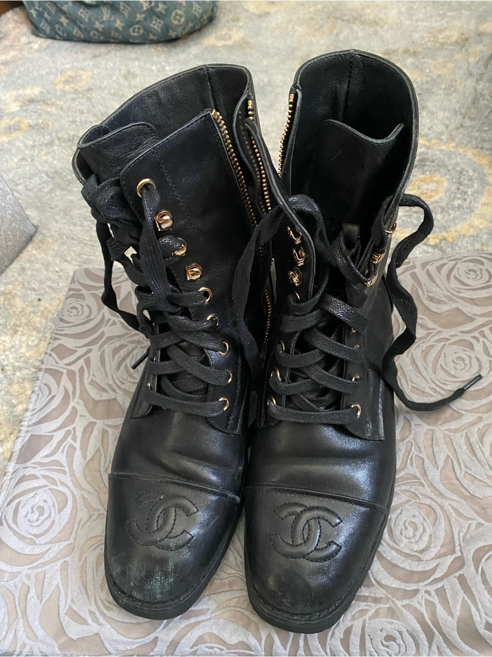 CHANEL Black Leather Lace-Up Combat Boots with Gold Hardware
